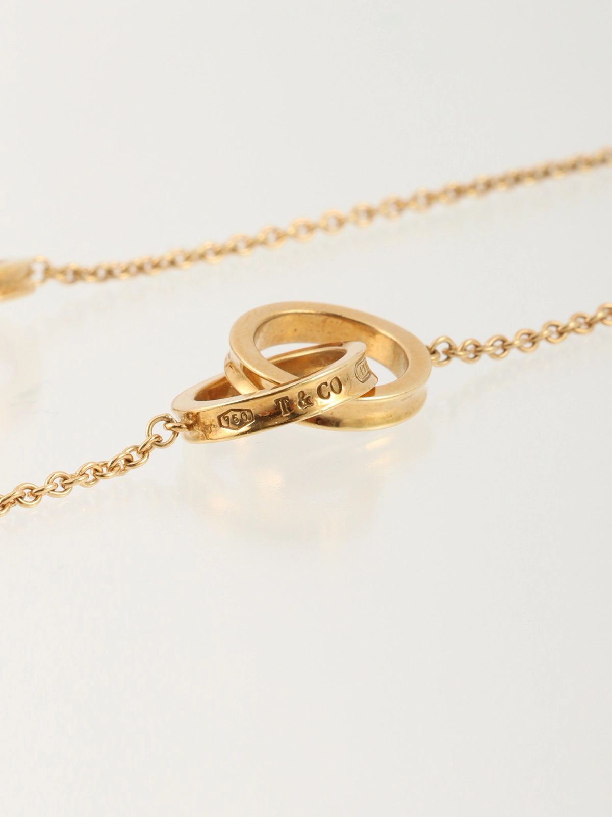 TIFFANY & CO. 18Kインターロッキングネックレス ゴールド